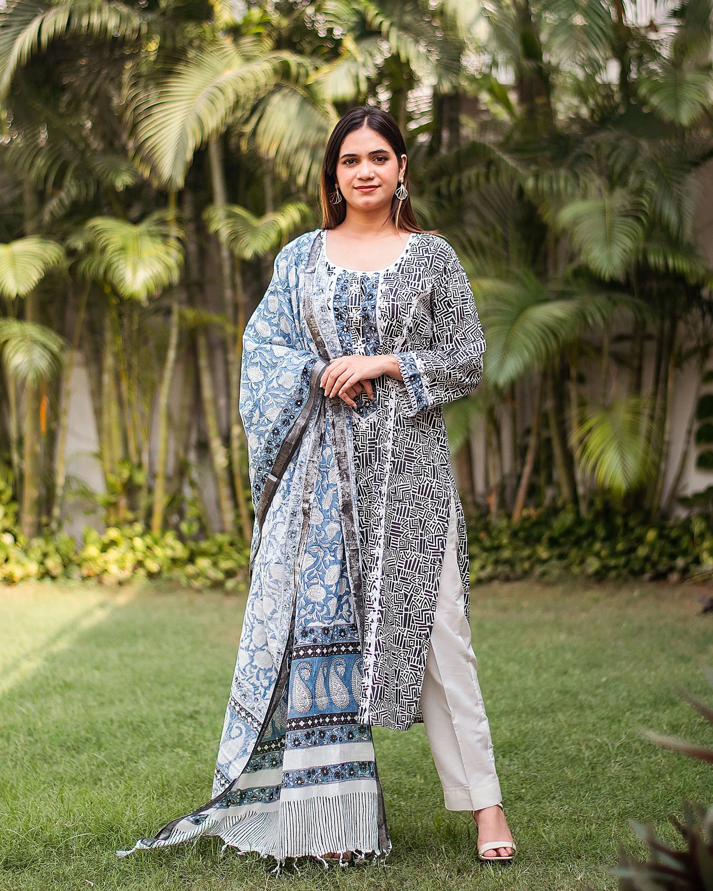 Another alternate front view (full suit, top to bottom): Another perspective of the black printed linen kurta, off-white trousers, and coordinating dupatta.