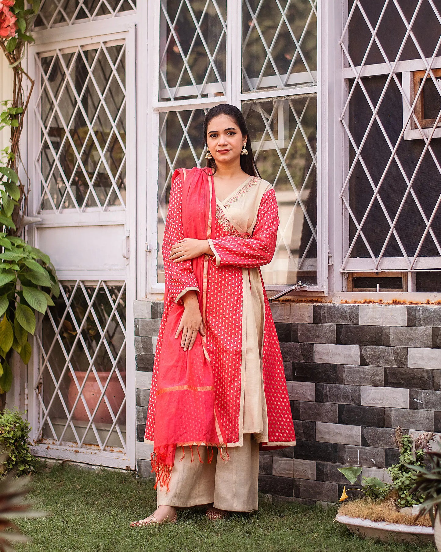 Orange brocade zardozi work angrakha, orange chanderi dupatta and golden palazzo