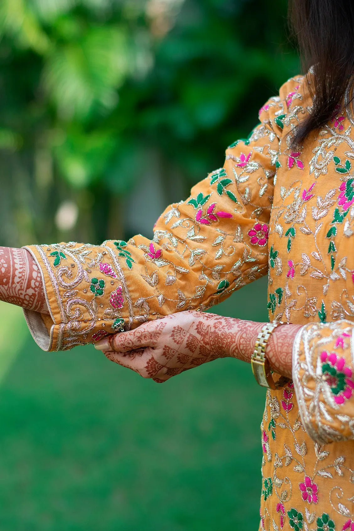 A woman in a Mustard Zardozi & Resham Embroidered Chanderi Kurta And Dupatta With Brocade Trousers.