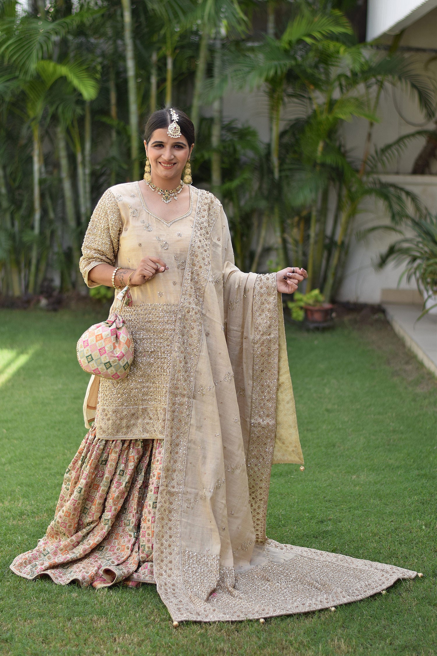 Golden bridal gharara suit with zardozi work