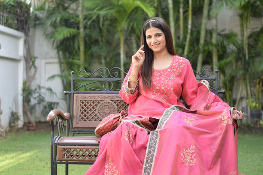 Indian Women wearing hand embroidered chanderi silk kurta set