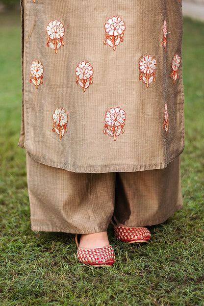 Close-up of the beige Chanderi palazzo worn by the model.