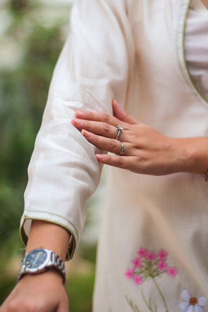 Close-up of the sleeve of the off-white angrakha kurta.