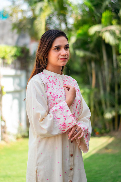  Side pose of an Indian model in a front-open kurta with Kashmiri embroidery. 