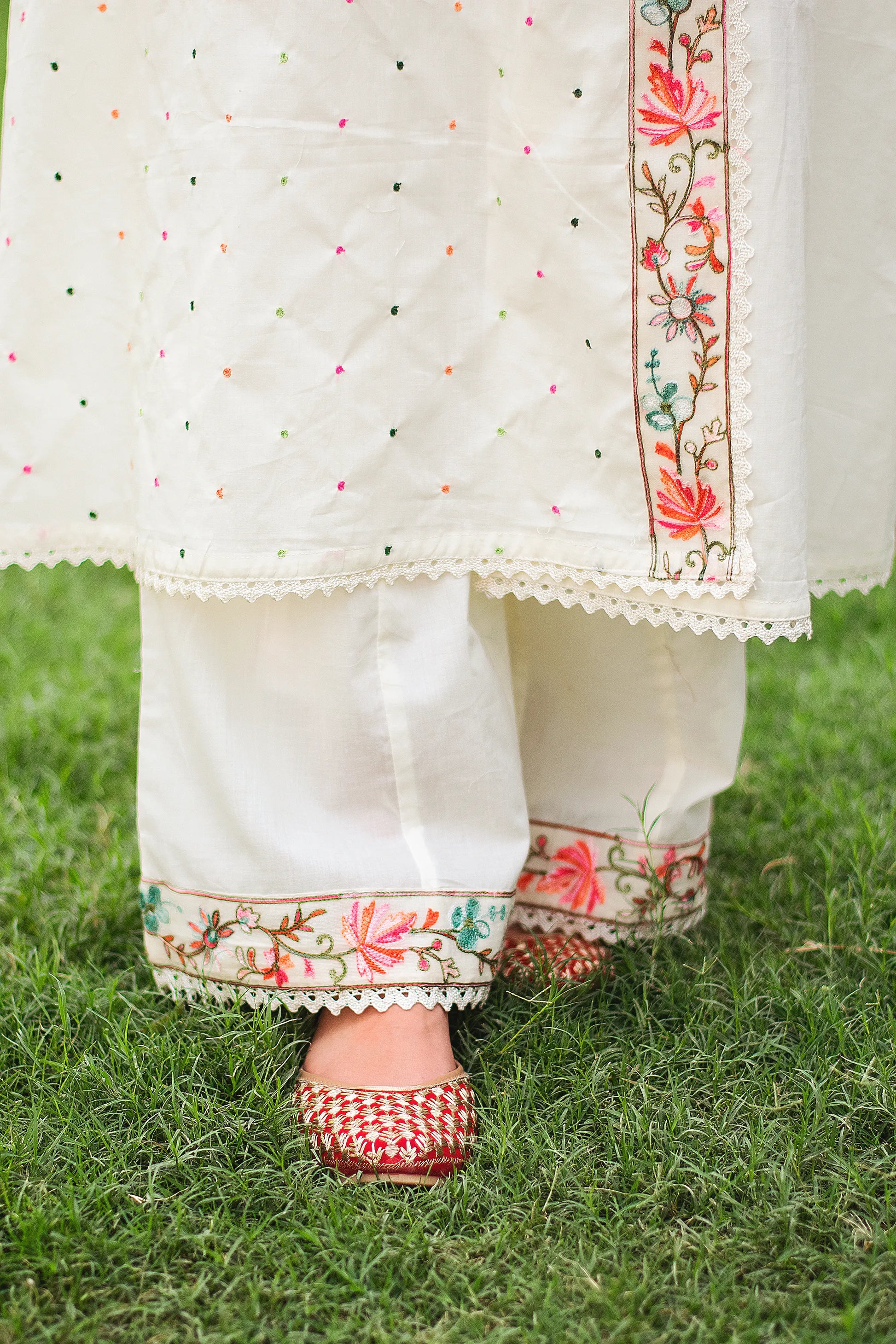 Close-up of an Indian woman's feet, wearing an off-white cotton angarkha