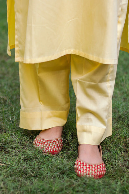 Pastel yellow russian silk kurta & trousers, peach chanderi dupatta with cutwork