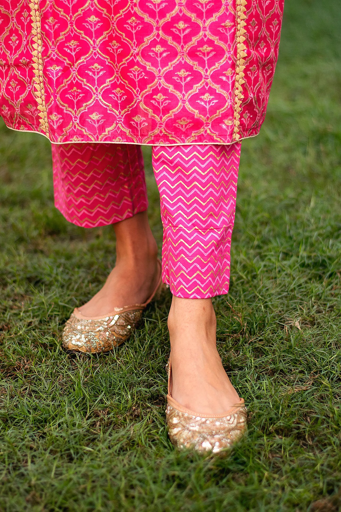 Close-up of the magenta chevron design foil-printed trousers paired with the magenta chanderi kurta.