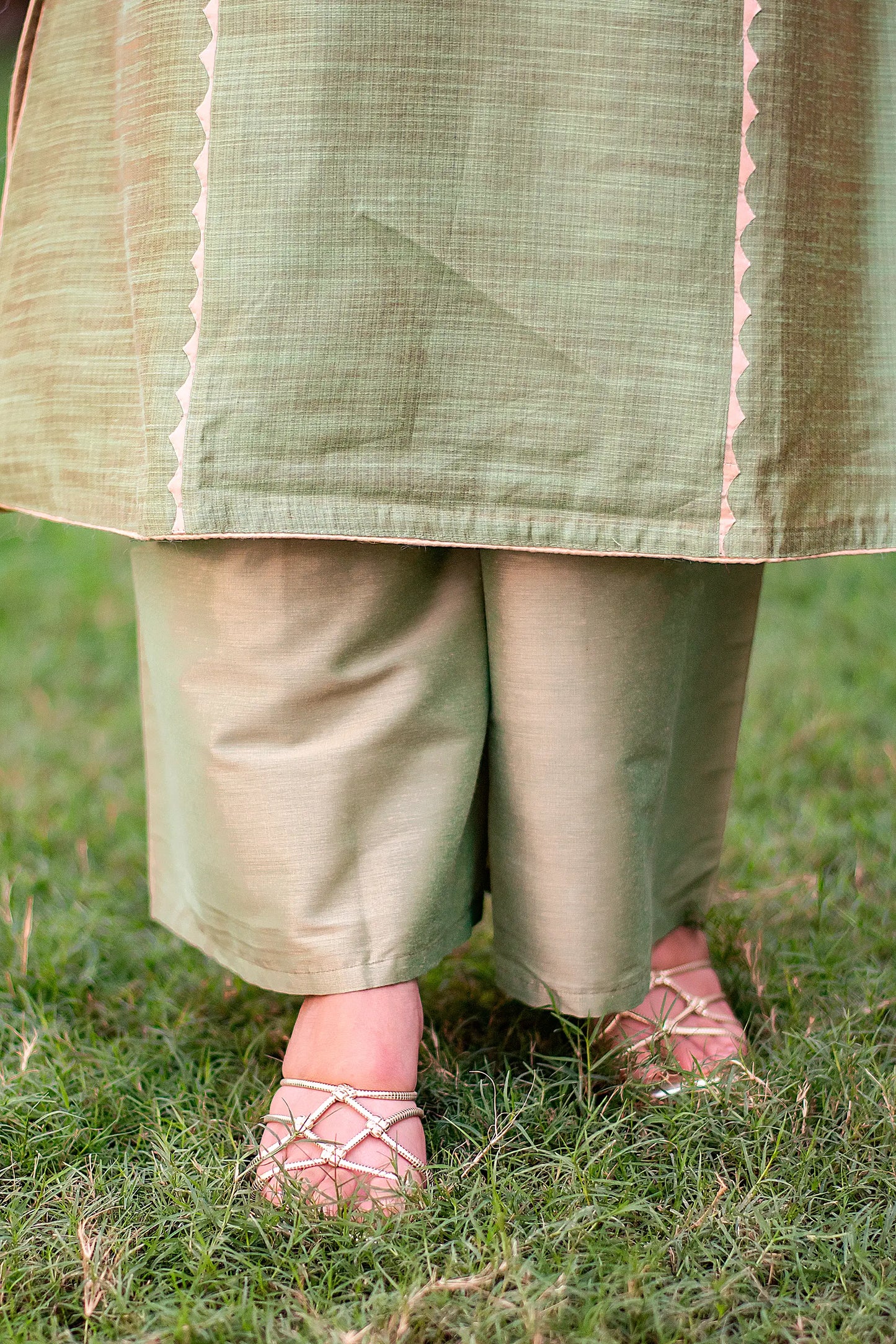 Close-up of the green tussar palazzo trousers, paired with the green jute silk kurta.