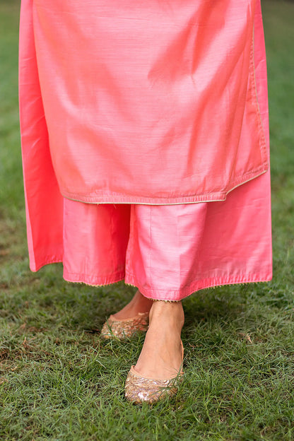 Close-up of the peach palazzo paired with the peach chanderi kurta, worn by an Indian model.