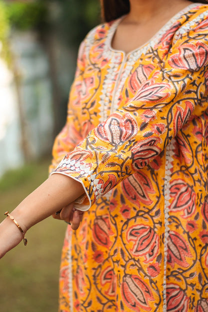 Yellow kalamkari print maheshwari applique work kalidar kurta with off white maheshwari dupatta and trousers