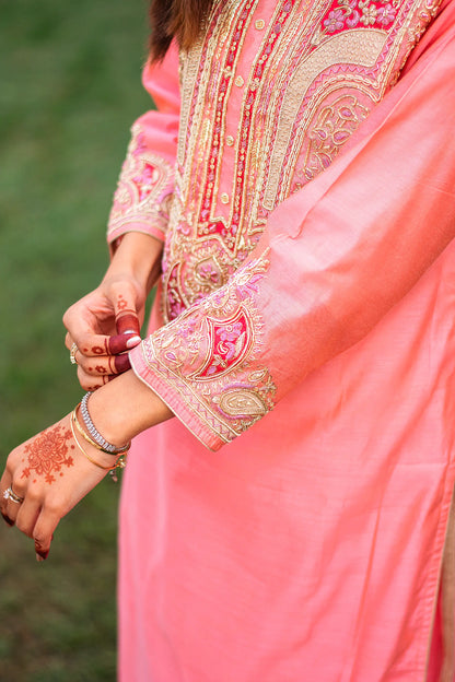 Close-up of the intricate zardozi work on the sleeve cuff of the peach chanderi kurta.