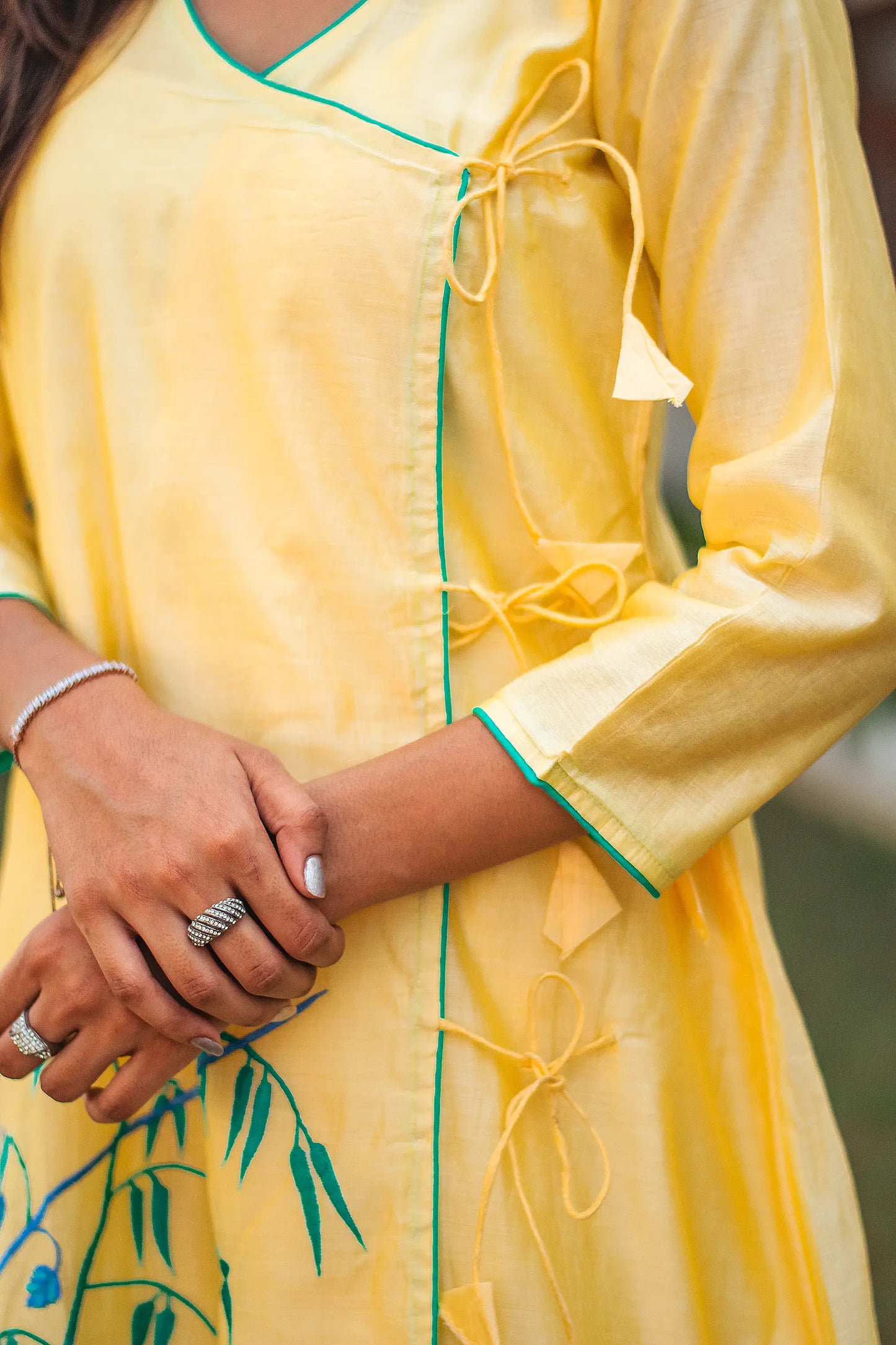 Close-up of the yoke of the yellow angrakha kurta