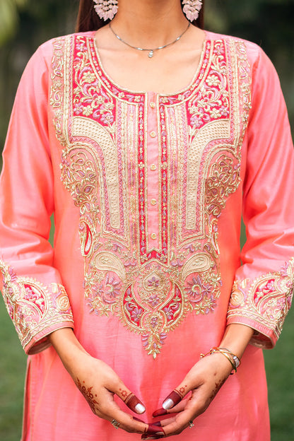 Close-up of the dense zardozi embroidery on the yoke of the peach chanderi kurta.