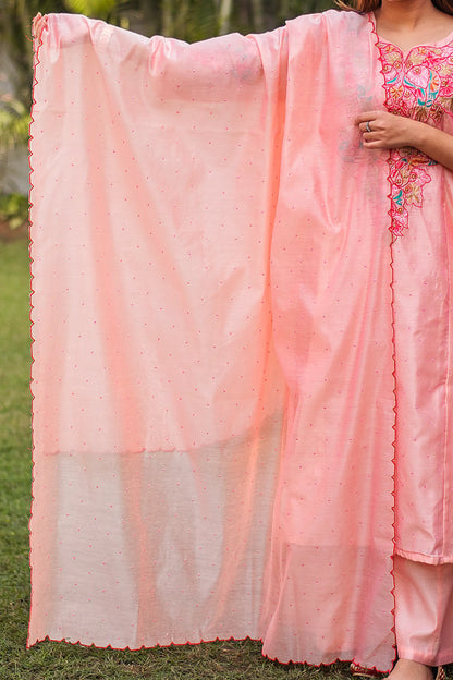 Indian model holding a peach Chanderi dupatta with pink sequins and scallop detailing around the border.