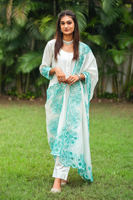 Complete ensemble of the off-white Chanderi suit, including the Chanderi kurta, dupatta, and cotton silk trousers, as worn by the model