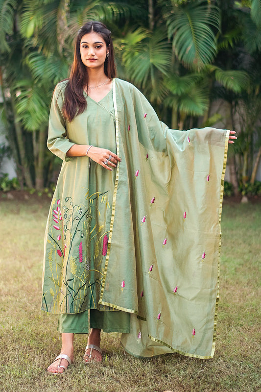 Model wearing the green kurta set in an elegant pose, showcasing the ensemble's style