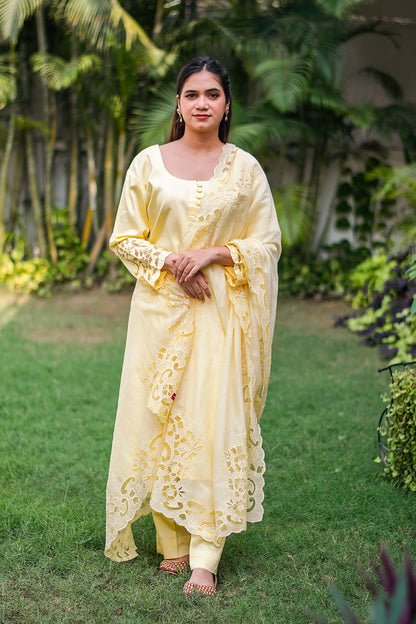 Pastel yellow russian silk kurta & trousers, peach chanderi dupatta with cutwork