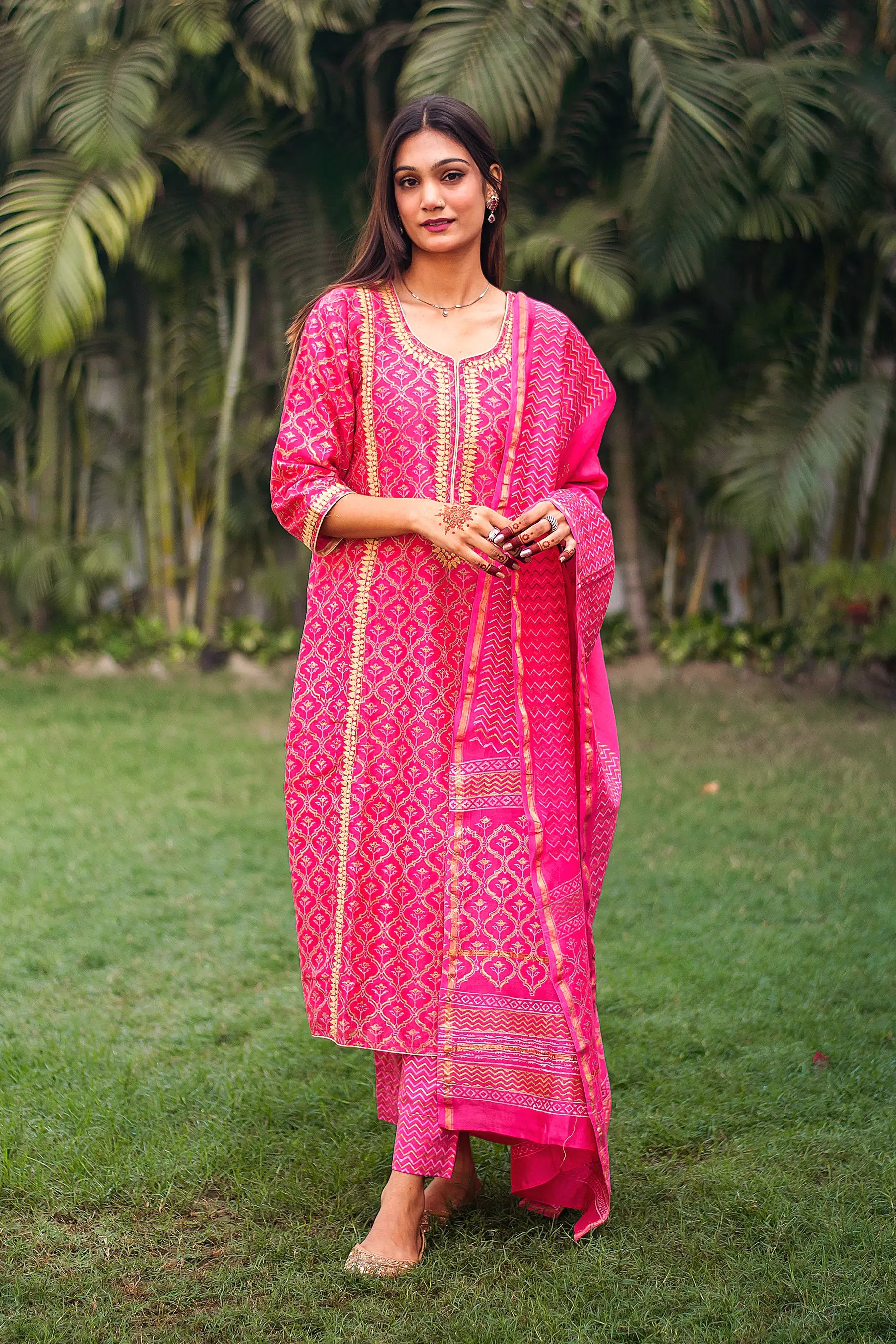 Indian model in a magenta foil-printed chanderi kurta with beige applique work, paired with matching dupatta and trousers