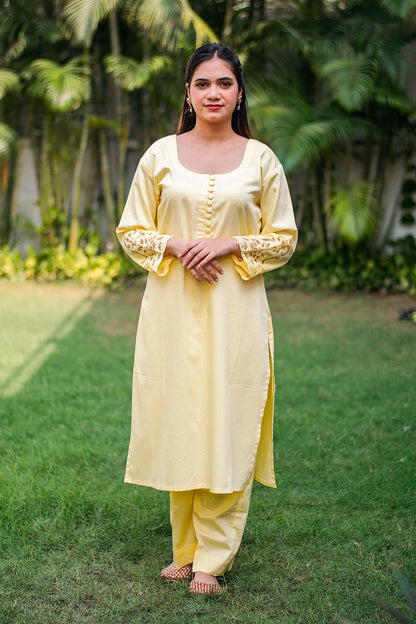 Pastel yellow russian silk kurta & trousers, peach chanderi dupatta with cutwork