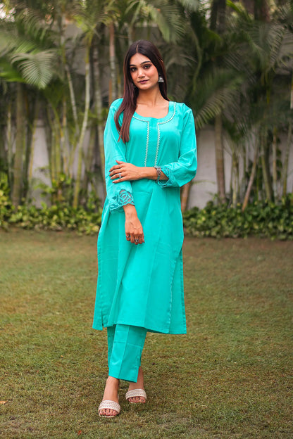 Turquoise green Russian silk kurta & trousers, turquoise green chanderi dupatta with cutwork.