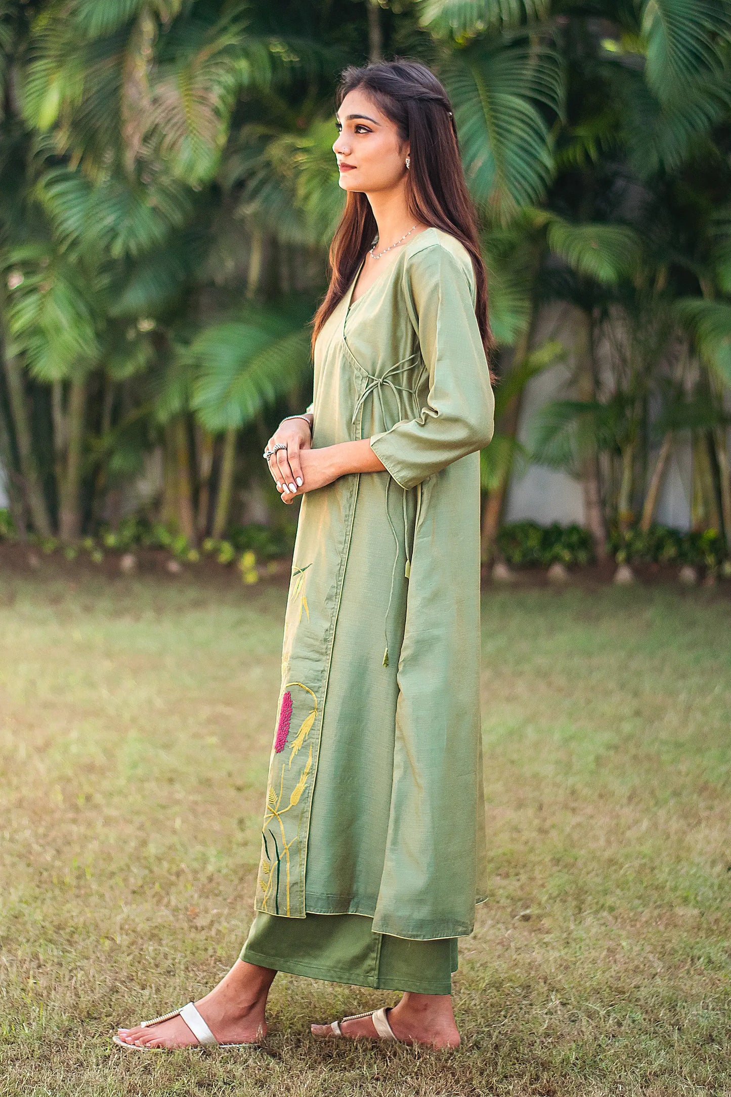 Left side view of a model wearing the angrakha kurta set, highlighting the angrakha kurta's elegant silhouette