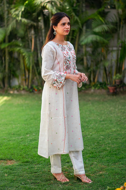  Indian model in a side profile, highlighting the embroidered kurta and plain trousers.