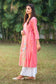 Left side view of a model wearing the pink chanderi kurta set, highlighting the silhouette of the angarkha.