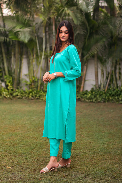 Turquoise green Russian silk kurta & trousers, turquoise green chanderi dupatta with cutwork.