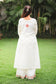 An Indian girl back pose in off-white colored Angarkha top
