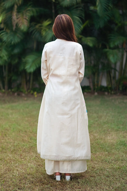 Back view of an Indian model wearing an off-white angrakha.