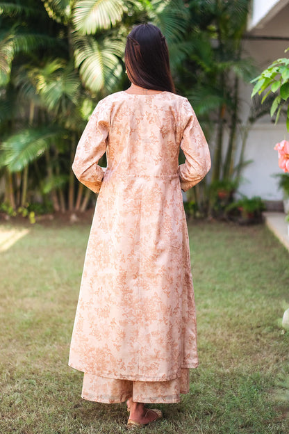 Back view of a model wearing the beige floral print kurta set, showcasing the full ensemble