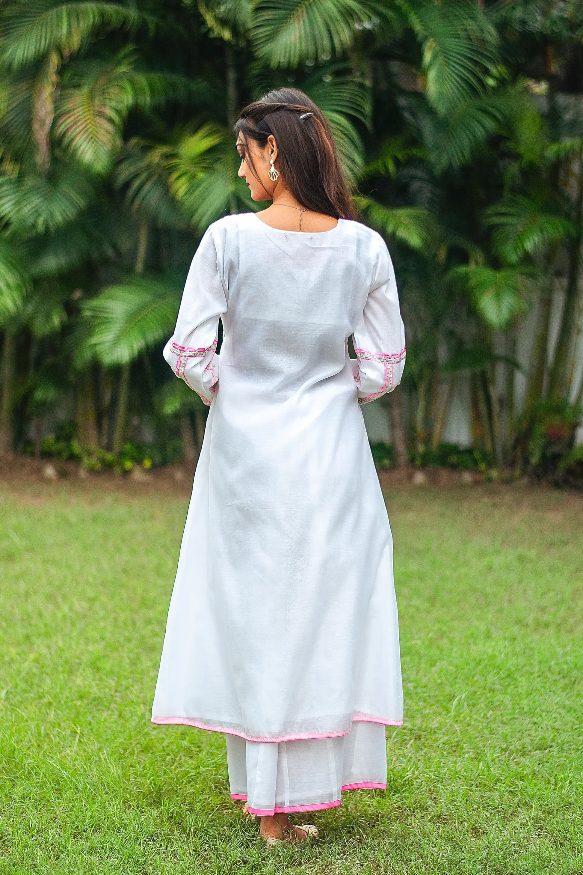 Back view of a white chanderi angarkha worn by Indian model.