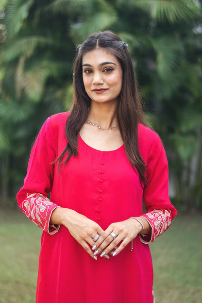 Zoomed-in shot highlighting the yoke of a red organza kurta worn by an Indian model.