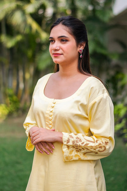 Pastel yellow russian silk kurta & trousers, peach chanderi dupatta with cutwork