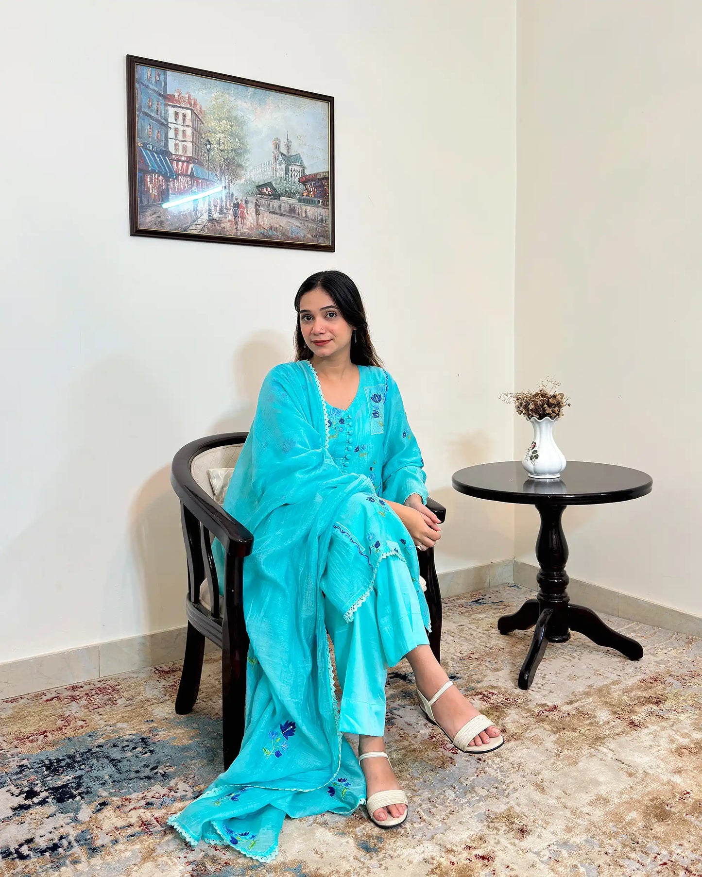 Front view of an aqua-blue chanderi kalidar kurta with dupatta on, featuring blue floral resham embroidery on both the kurta and dupatta, paired with aqua-blue trousers.