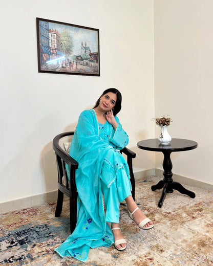 Front view of an aqua-blue chanderi kalidar kurta with dupatta on, featuring blue floral resham embroidery on both the kurta and dupatta, paired with aqua-blue trousers.