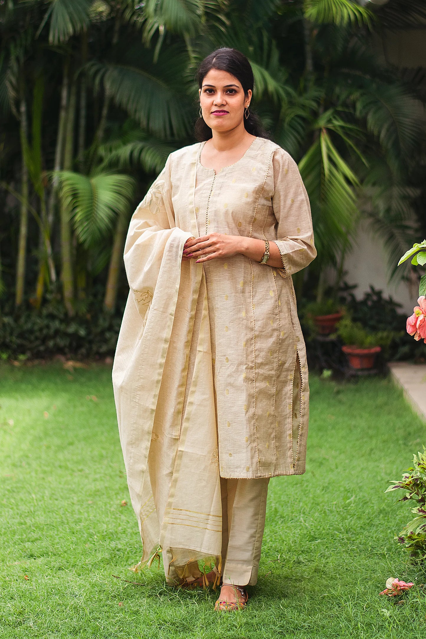 Beige double kali kurta with beige cutwork dupatta and beige trousers