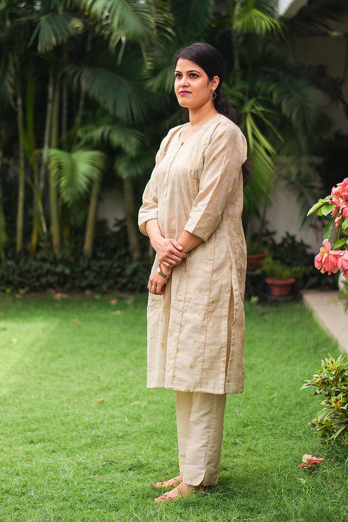 Beige double kali kurta with beige cutwork dupatta and beige trousers