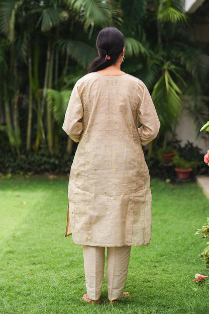 Beige double kali kurta with beige cutwork dupatta and beige trousers