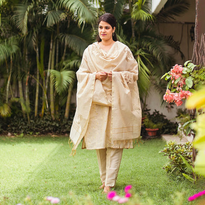 Beige double kali kurta with beige cutwork dupatta and beige trousers