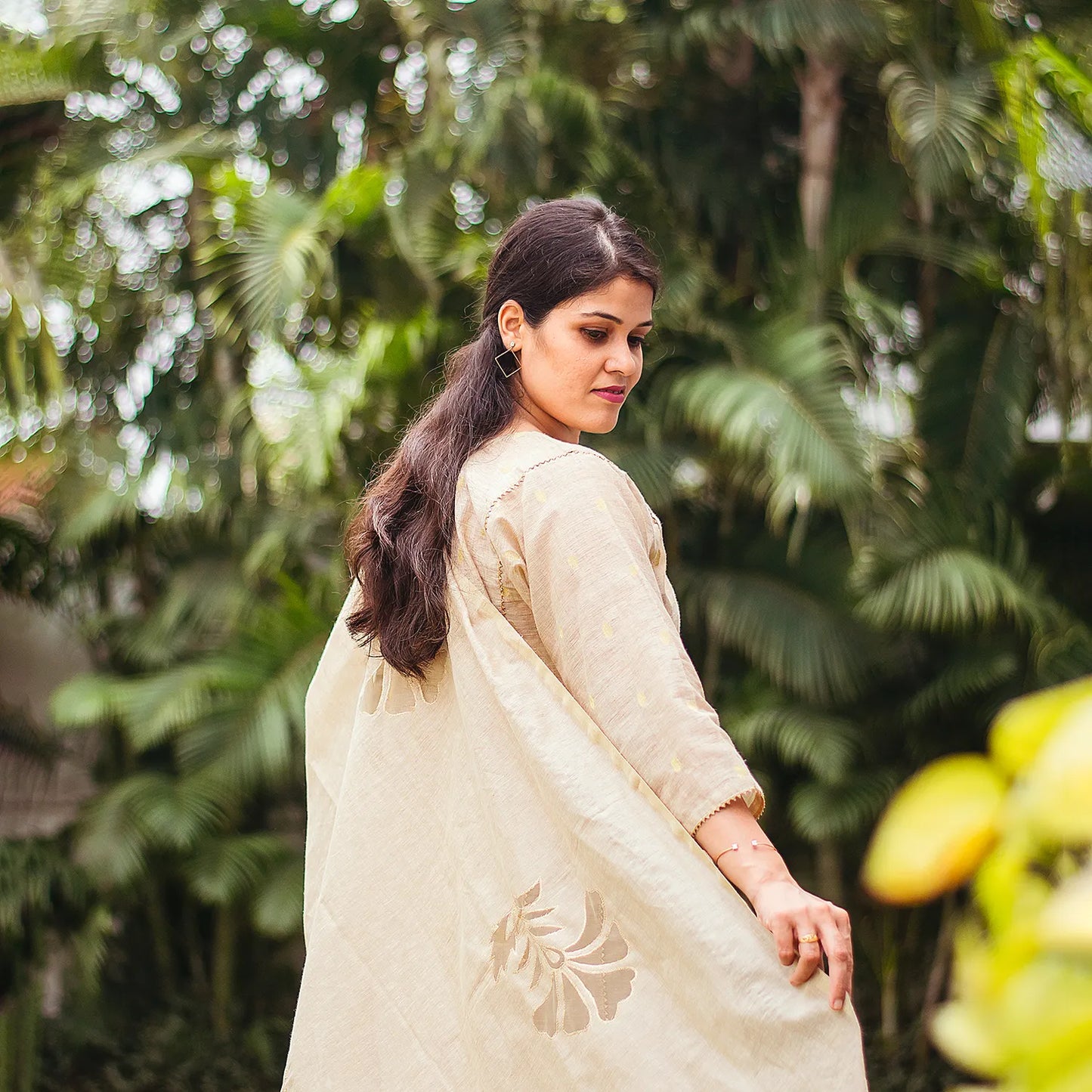 Beige double kali kurta with beige cutwork dupatta and beige trousers