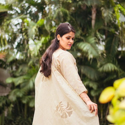 Beige double kali kurta with beige cutwork dupatta and beige trousers