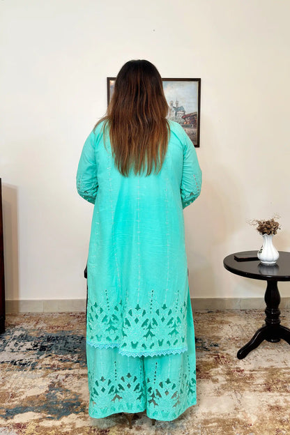 Back view of the aqua-green cotton straight kurta with floral cutwork embroidery and matching aqua-green palazzo.