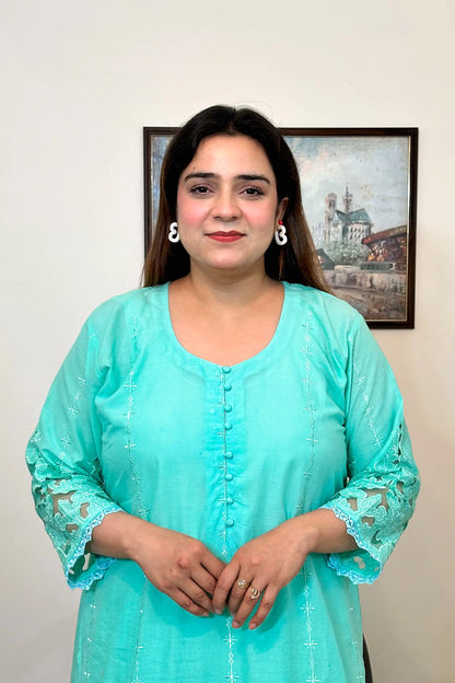 Close-up front view of the aqua-green cotton straight kurta showing the button placket and floral embroidery detail.