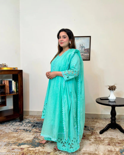 Side view of the aqua-green cotton straight kurta and net dupatta with floral cutwork embroidery, paired with matching aqua-green palazzo.