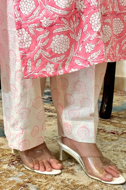 Pink printed mulmul cotton kalidar kurta, white printed mulmul dupatta with applique work and off-white printed trousers