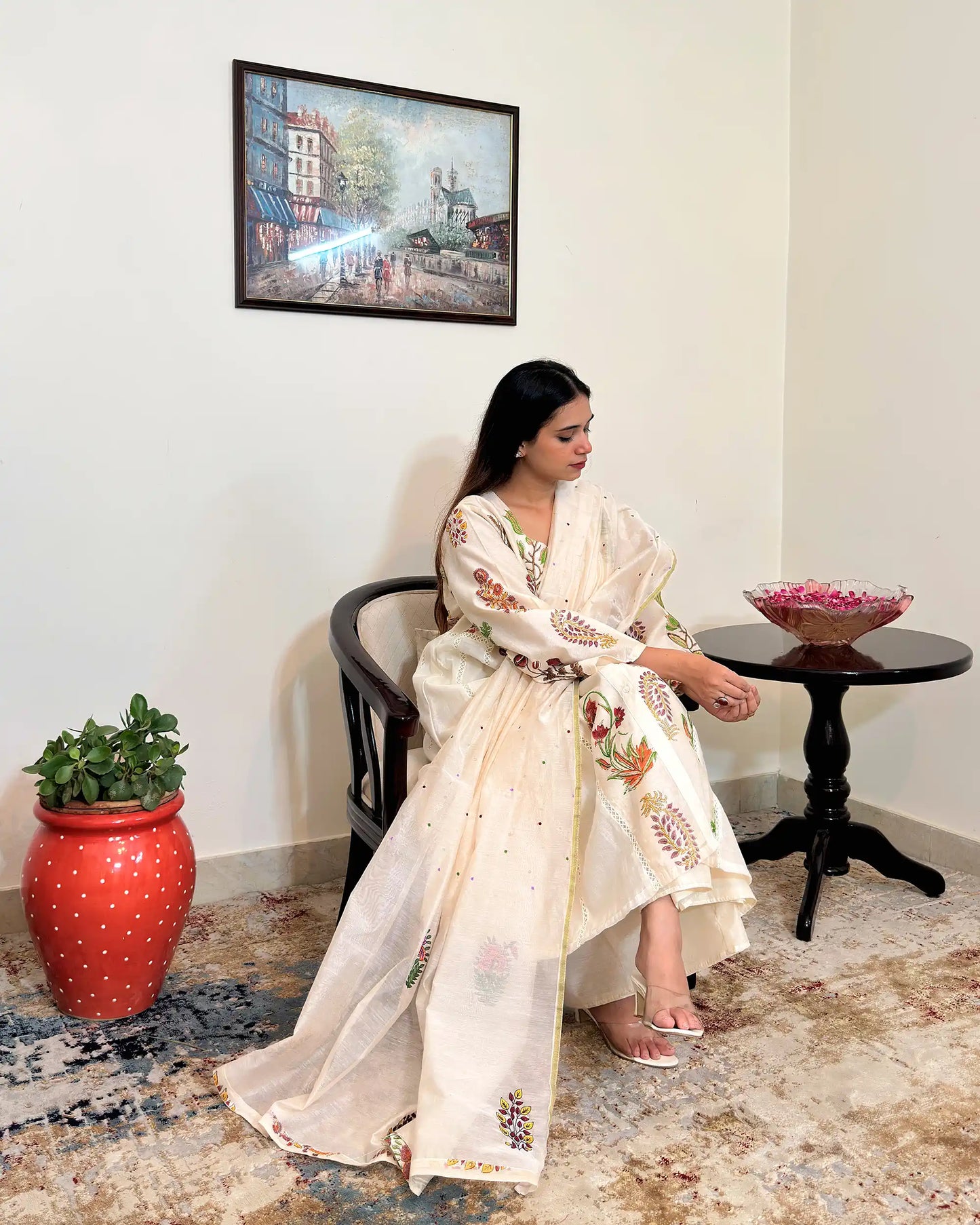 Front view of an off-white chanderi A-line kurta and dupatta with multicolour floral hand embroidery, paired with off-white palazzo.
