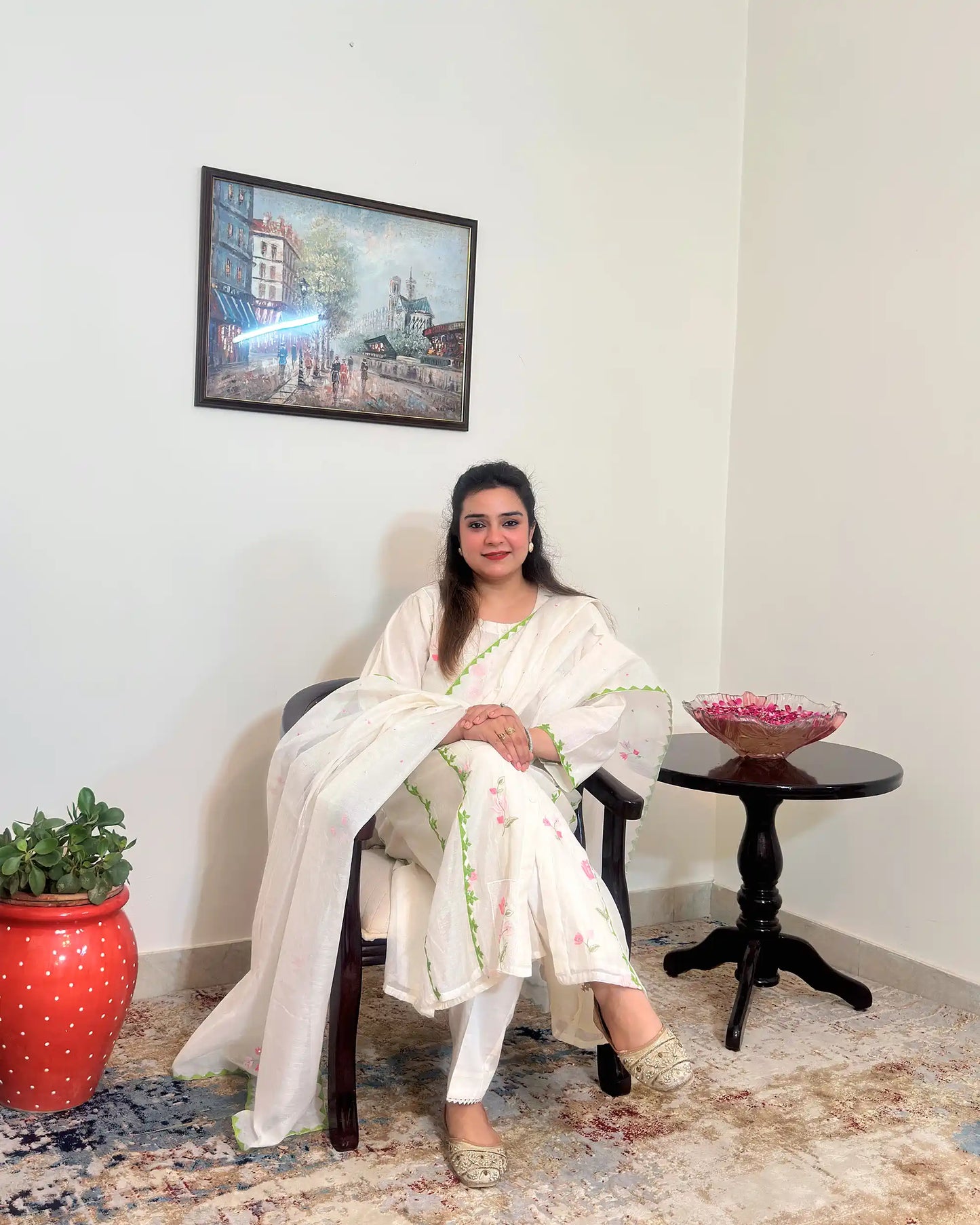 Front view of the off-white chanderi A-line kurta and dupatta with pink embroidery and green applique work, dupatta on.