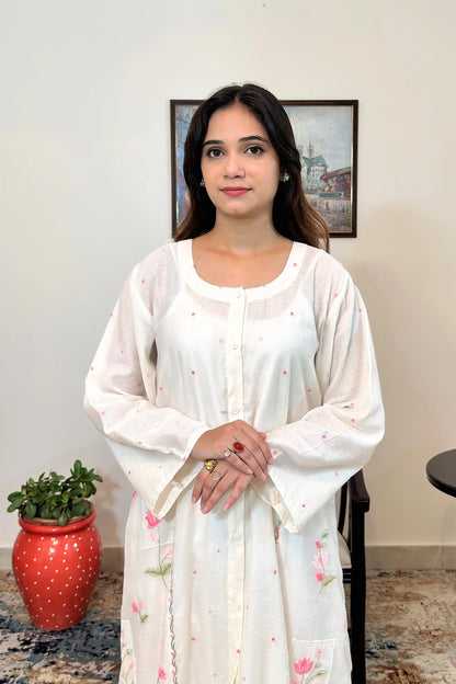 Front view of the off-white chanderi A-line kurta with pink resham embroidery.