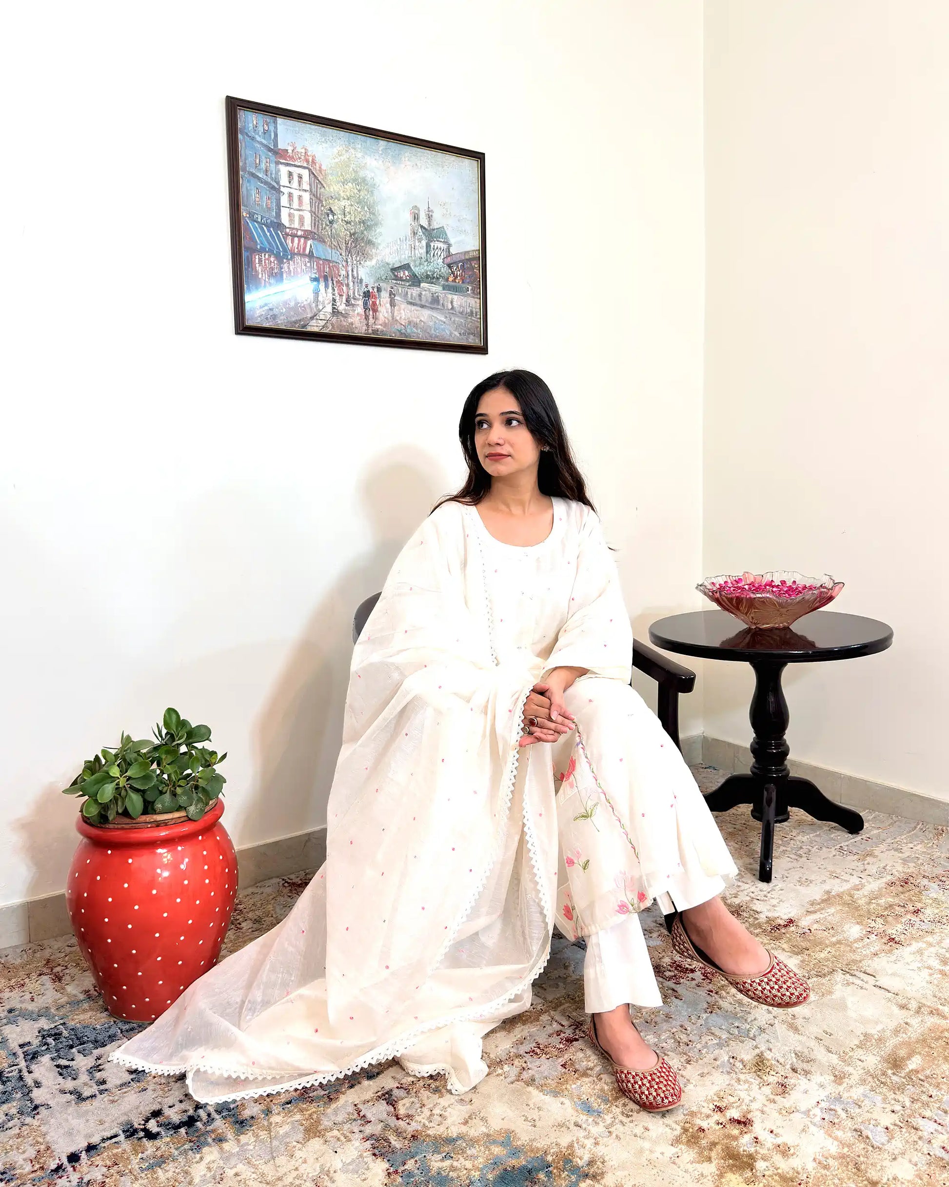 Front view of the off-white chanderi A-line kurta and dupatta with pink resham embroidery, worn with off-white trousers.